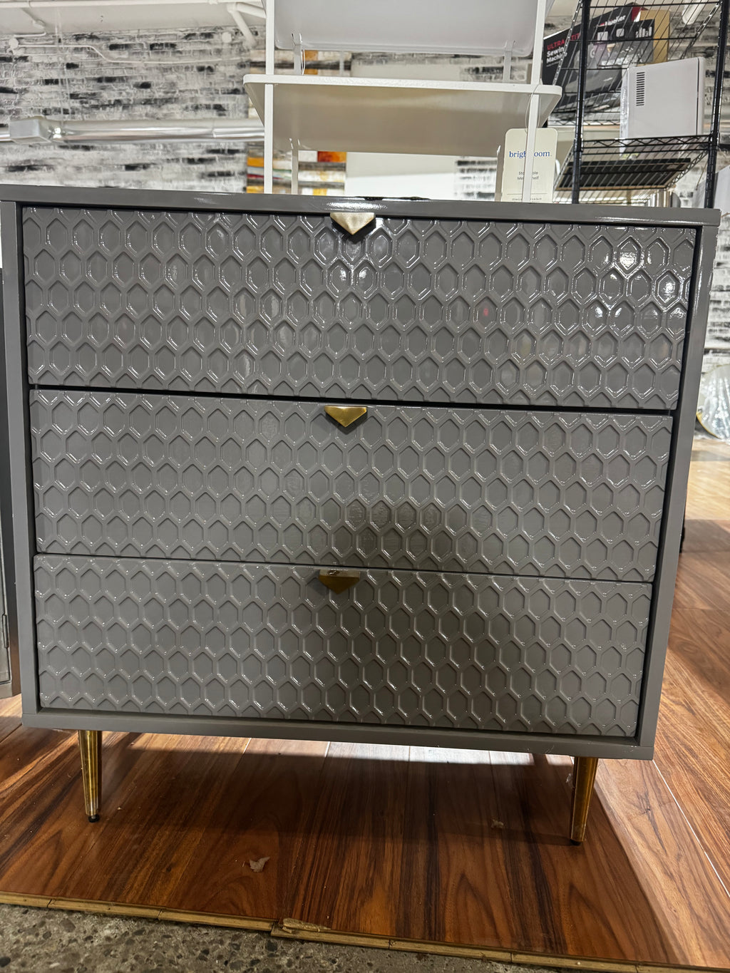 Metal dresser with gold handles.